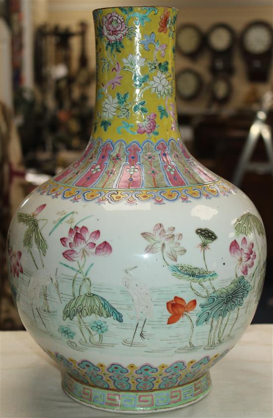 A Chinese famille rose bottle vase, Daoguang seal mark and of the period (1821-50), 36cm, neck reduced, base drilled